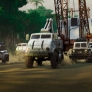 Construction trucks driving through the rainforest_1.1324.1