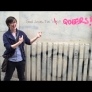 8. Lyra at wall, pointing to graffiti “God Loves the QUEERS’